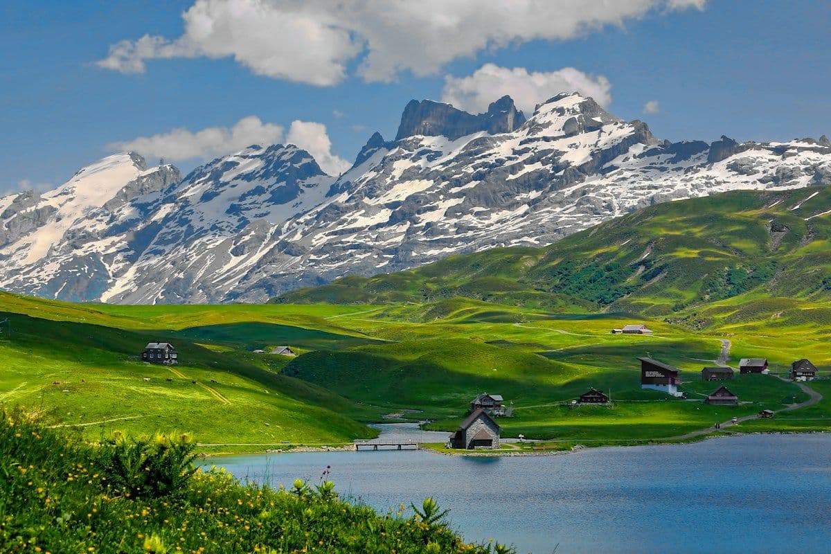 Swiss Alps Mountain Train and Turquoise Alpine Lakes in Switzerland